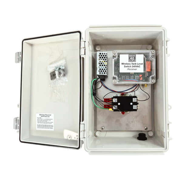 Wireless tank level switch receiver system housed in a white protective casing with internal wiring and components.