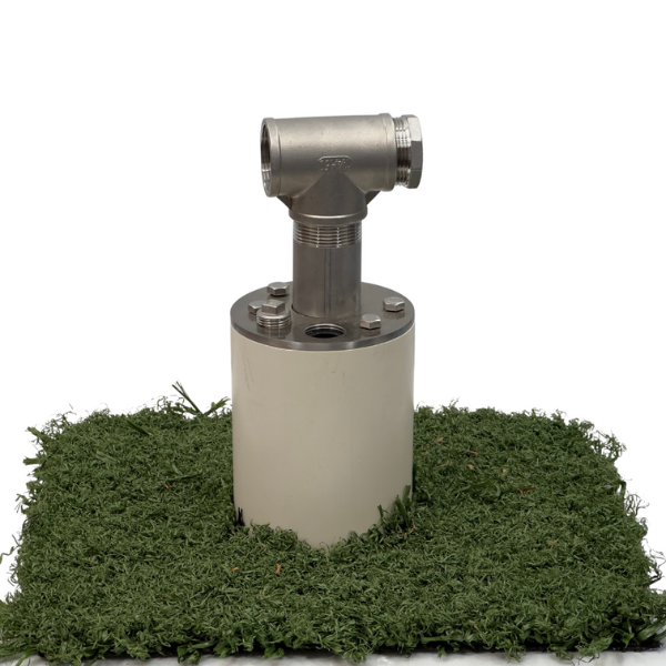 stainless steel well seal assembly installed on green artificial turf background